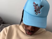 video of our blue trucker hat with our warm heavyweight hoodie